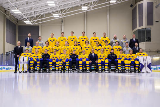 Players and team staff of Sweden pose for a team photo