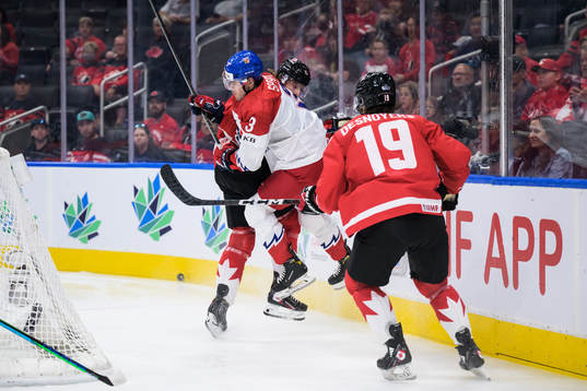 David Spacek of Czech Republic tackles Brennan Othmann of