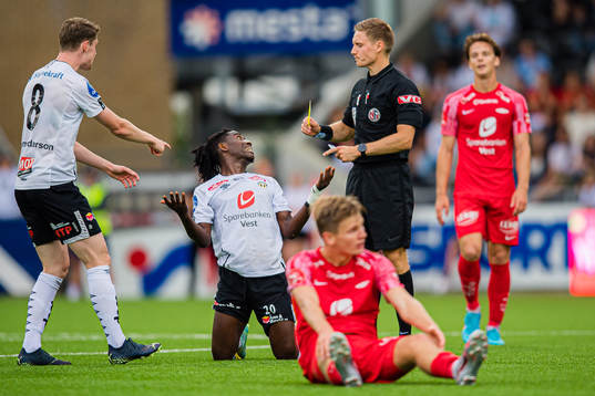 Isaac Twum of Sogndal after receiving his second yellow card by Mathias Støfringshaug, referee,