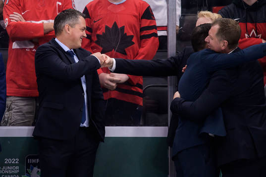 Head coach Tomas Montén of Sweden celebrate with video