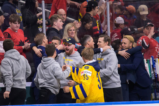 Assistant coach Patrik Andersson, equipment manager Sam