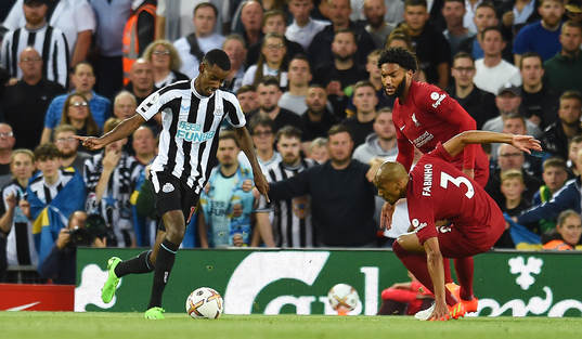 Alexander Isak of Newcastle United and Joe Gomez and
