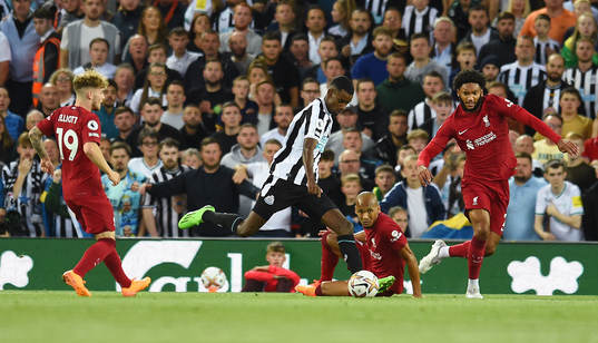 Alexander Isak of Newcastle United and Joe Gomez and