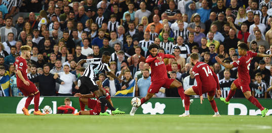 Alexander Isak of Newcastle United and Joe Gomez and