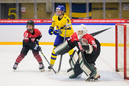 Chisato Miyazaki of Japan and goaltender Miyuu Masuhara of