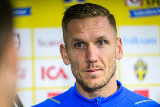 goalkeeper Robin Olsen is being interviewed by media in the mixed zone