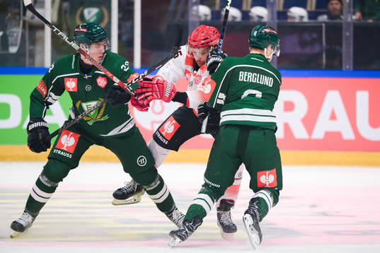 Lucas Forsell of Färjestad and Anton Berglund with Damian