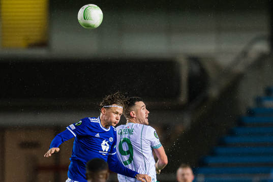 Birk Risa of Molde and Aaron Greene of Shamrock Rovers