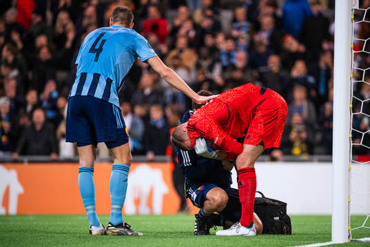 Goalkeeper Aleksandr Vasiutin of Djurgården in pain