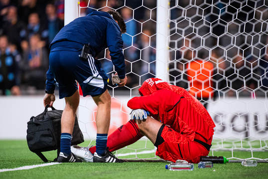 Goalkeeper Aleksandr Vasiutin of Djurgården in pain