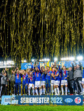 Magnus Wolff Eikrem and players of Molde celebrate with the trophy after winning the league during the Eliteserien football match between Molde and Sandefjord on November 6, 2022 in Molde. 
