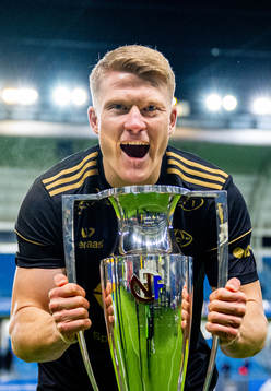 Kristian Eriksen of Molde celebrates with the trophy after winning the league