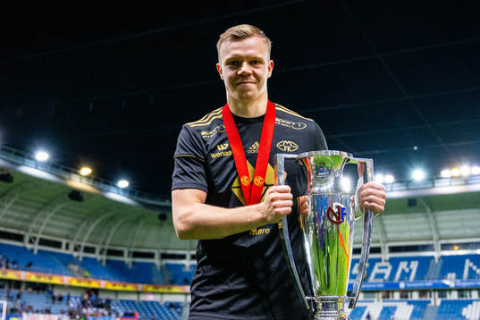 Eirik Haugan of Molde celebrates with the trophy after winning the league