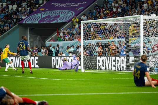 Craig Goodwin of Australia scores the 0-1 goal behind