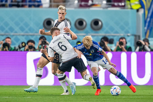 Nico Schlotterbeck and Joshua Kimmich of Germany with Junya