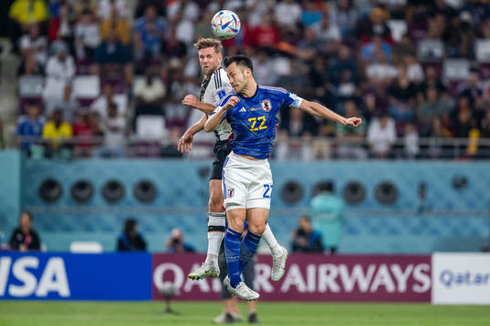 Niclas Füllkrug of Germany and Maya Yoshida of Japan
