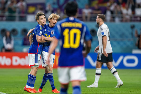Ritsu Doan and Junya Ito of Japan celebrate