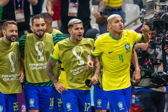 Richarlison of Brazil celebrates with team mates