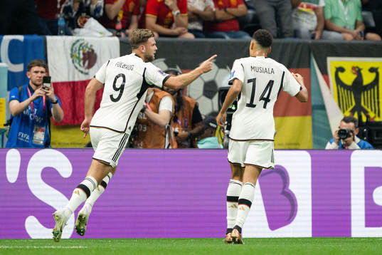 Niclas Füllkrug and Jamal Musiala of Germany celebrate the 1-1 goal