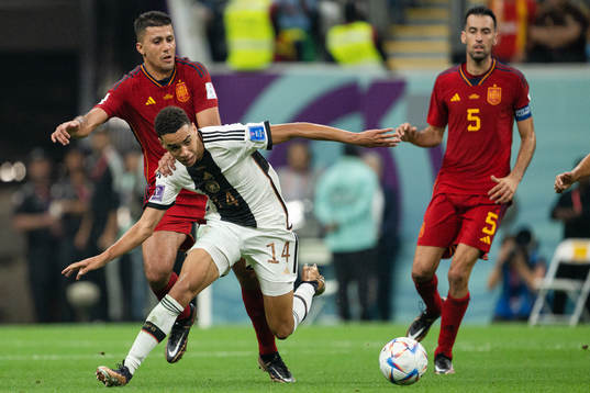 Jamal Musiala of Germany and Rodri of Spain