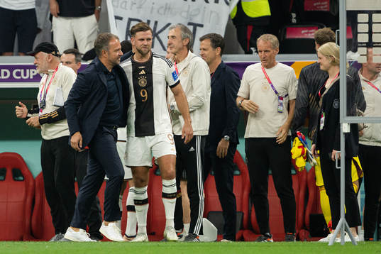 Niclas Füllkrug and head coach Hansi Flick of Germany