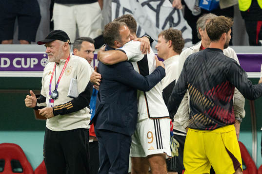 Niclas Füllkrug and head coach Hansi Flick of Germany