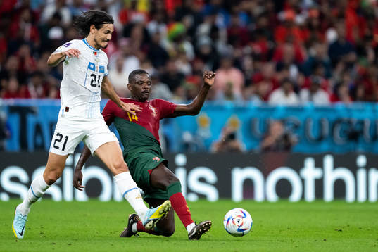 Edinson Cavani of Uruguay and William Carvalho of Portugal