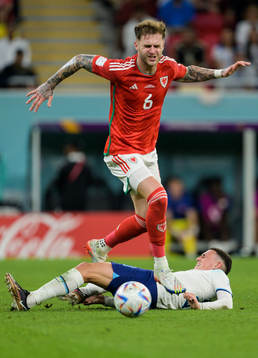 Joe Rodon of Wales and Phil Foden of England