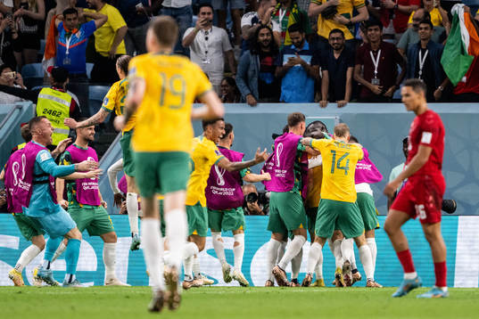Mathew Leckie of Australia celebrate with team mates after the 1-0 goal
