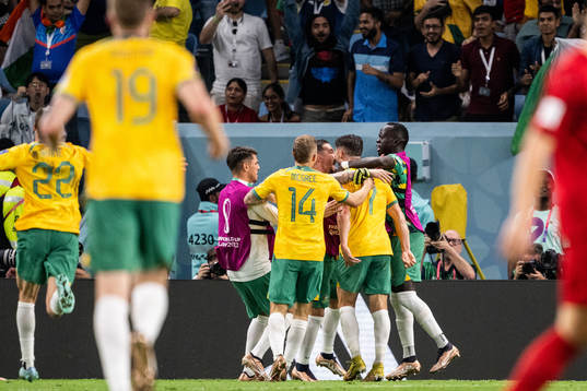 Mathew Leckie of Australia celebrate with team mates after the 1-0 goal