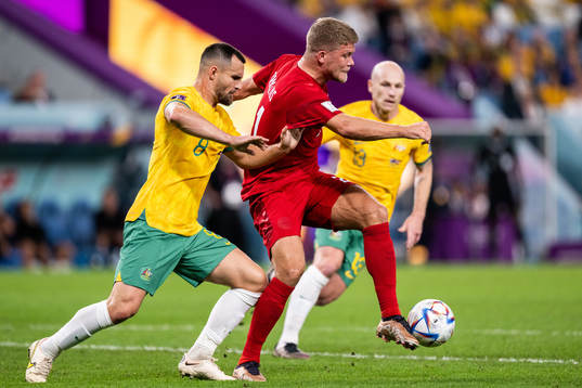 Bailey Wright of Australia and Andreas Cornelius of Denmark