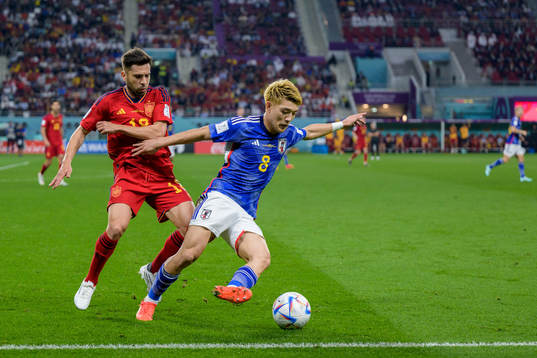 Jordi Alba of Spain and Ritsu Doan of Japan