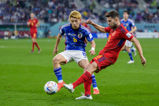 Ritsu Doan of Japan and Jordi Alba of Spain