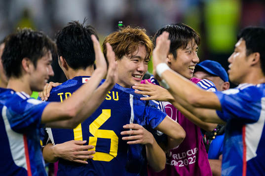 Takehiro Tomiyasu, Kou Itakura and Hiroki Ito of Japan celebrate