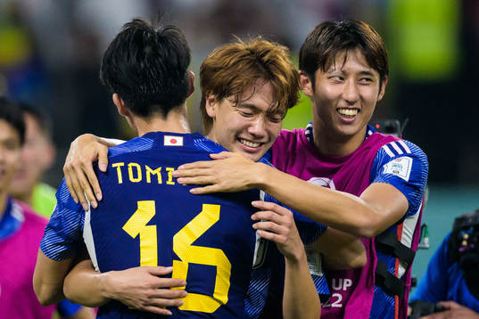 Takehiro Tomiyasu, Kou Itakura and Hiroki Ito of Japan celebrate
