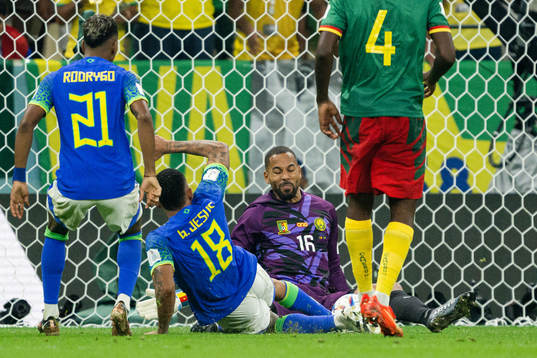 Gabriel Jesus of Brazil abasing goalkeeper Devis Epassy of Cameroon