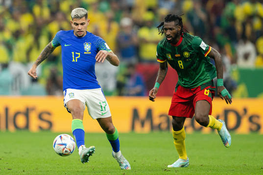 Bruno Guimaraes of Brazil and Andre-Frank Zambo Anguissa of Cameroon