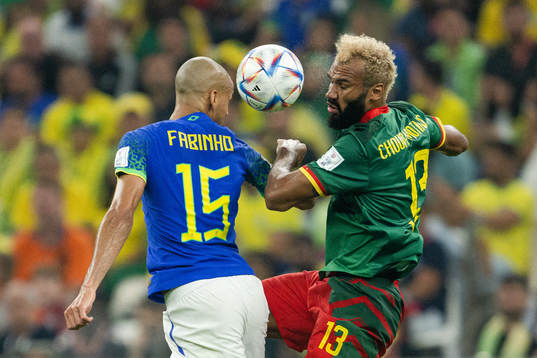 Fabinho of Brazil and Eric Maxim Choupo-Moting of Cameroon
