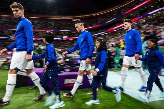 John Stones, Phil Foden and Declan Rice of England ahead of the FIFA World Cup 2022 round of 16 football match between England and Senegal on December 4, 2022 in Doha. 