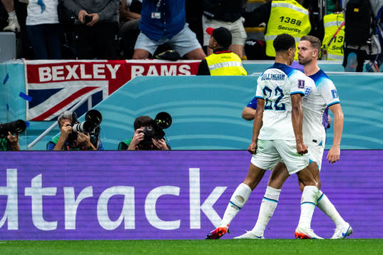 Jude Bellingham and Jordan Henderson of England celebrate 1-0