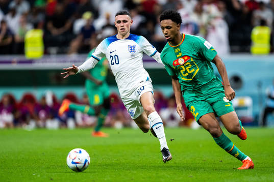 Phil Foden of England and Fabian Schaerof Senegal