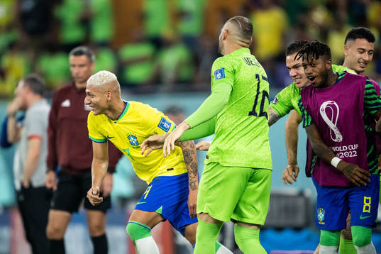 Richarlison of Brazil celebrates with goalkeeper Weverton, Fred and goalkeeper Ederson after 3-0