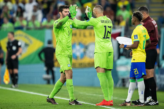 Goalkeeper Alisson of Brazil is substituted off for goalkeeper Wevertonduring the FIFA World Cup 2022 round of 16 football match between Brazil and South Korea