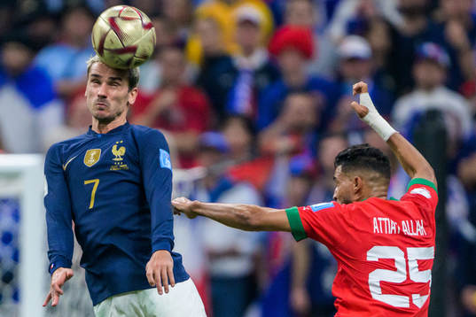 Antoine Griezmann of France and Yahya Attiat-Allah of Morocco