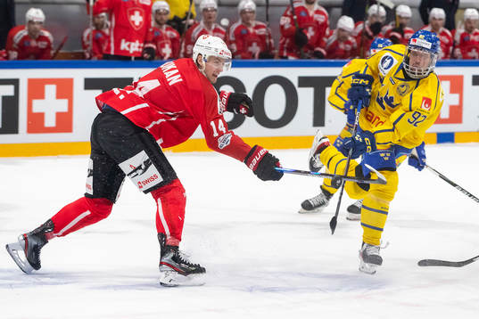 Dean Kukan of Switzerland and Jesper Olofsson of Sweden