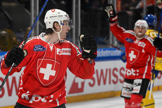 Dean Kukan of Switzerland celebrates