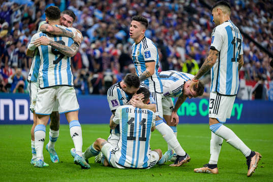 Angel de Maria and Lionel Messi of Argentina celebrate