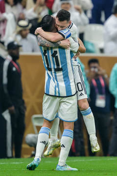Angel de Maria and Lionel Messi of Argentina celebrate