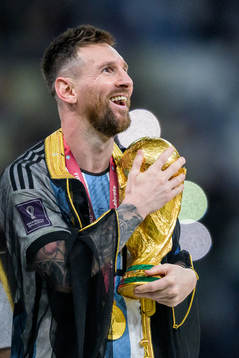 Lionel Messi of Argentina with FIFA World Cup Trophy