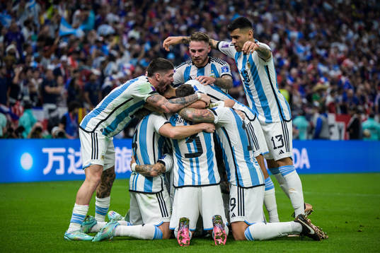 Players of Argentina celebrate the 2-0 goal by Angel de